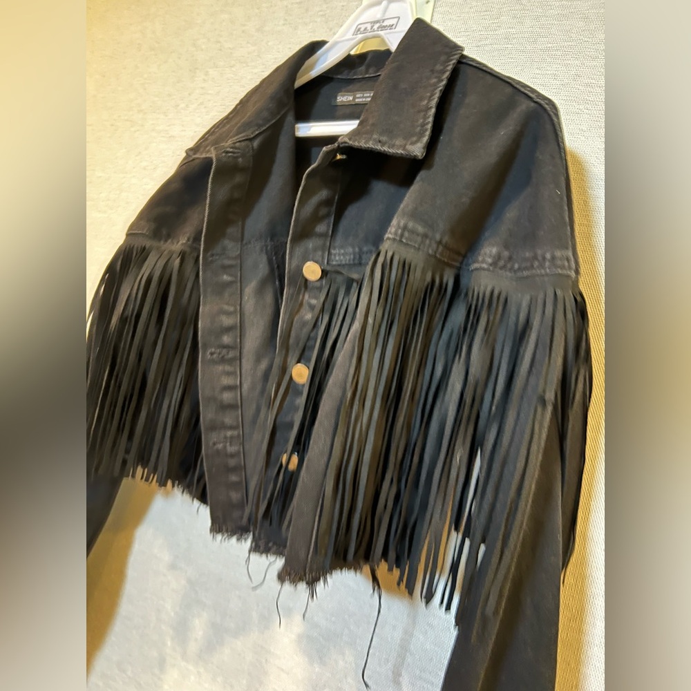Cropped black denim jacket with frills